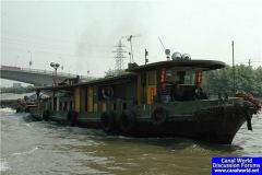 Happy tug crew, Grand Canal, China