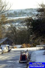 Frozen Peak Forest canal pictured from bridge No1, Marple.